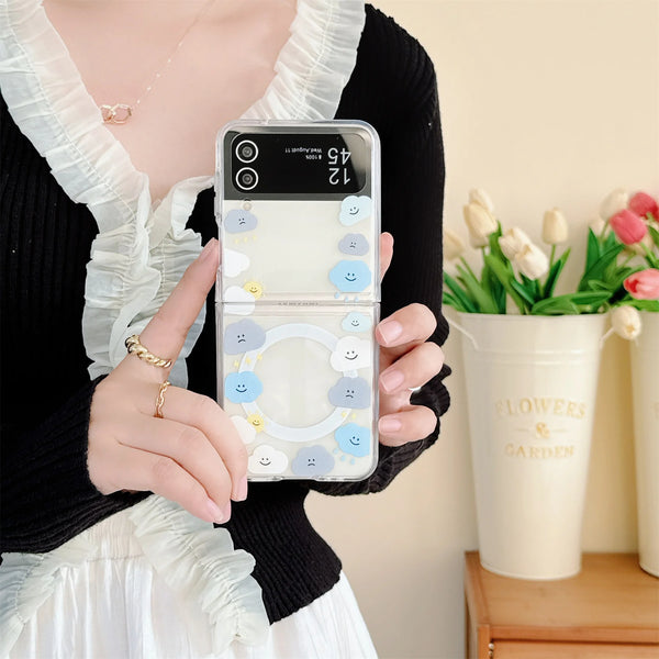 Close-up of a cute cloud phone case with a beaded strap in pastel colors, held by a woman