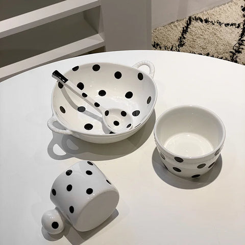 Set of polka dot ceramic dishes and coffee cups with coordinating patterns